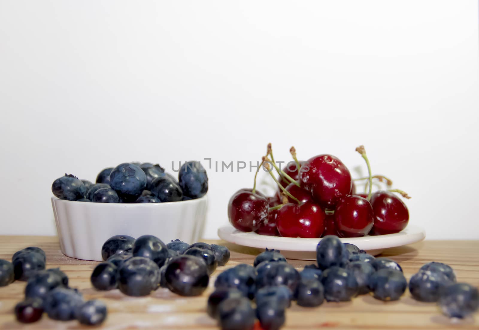red fruits with rustic wood background