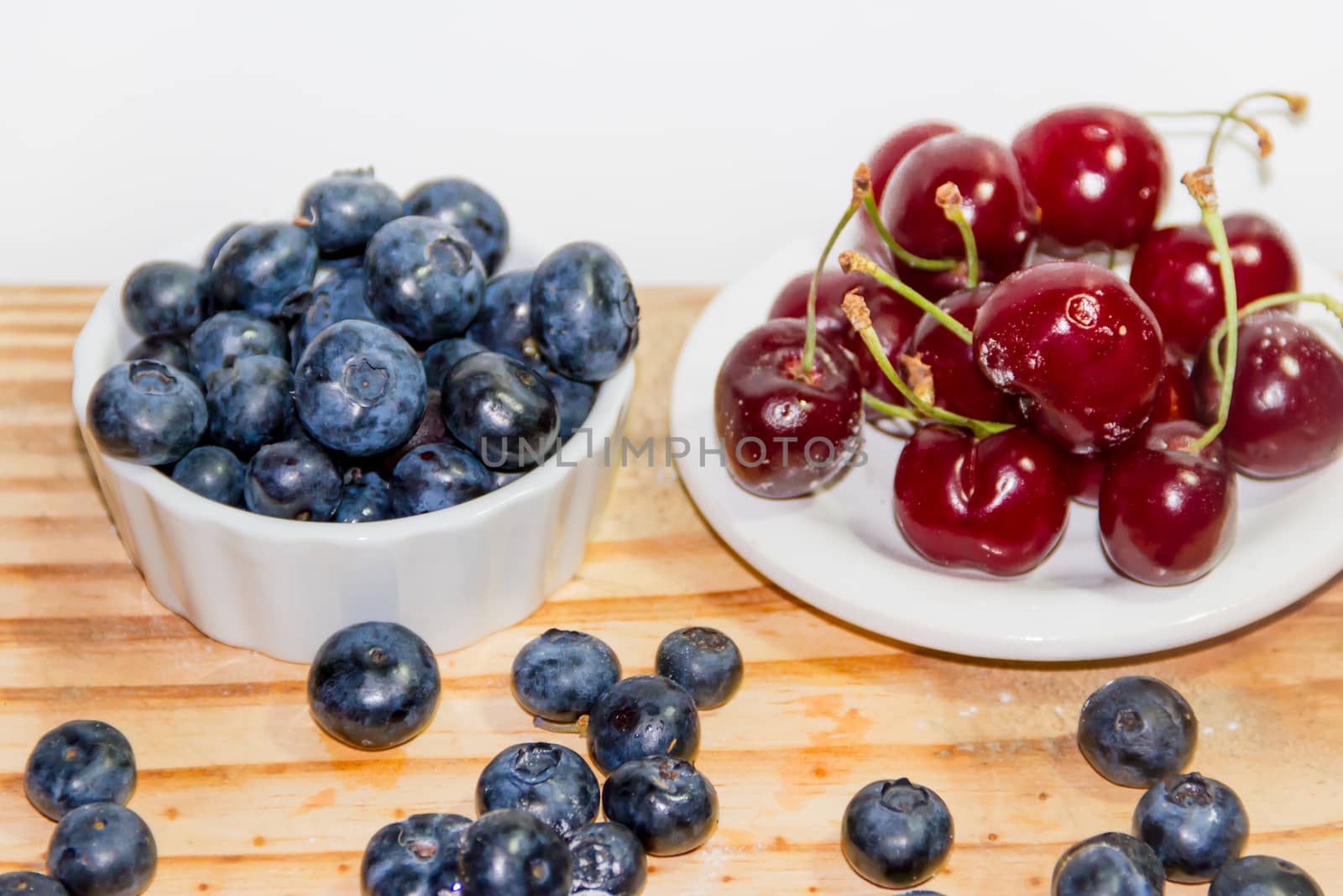 red fruits with rustic wood background