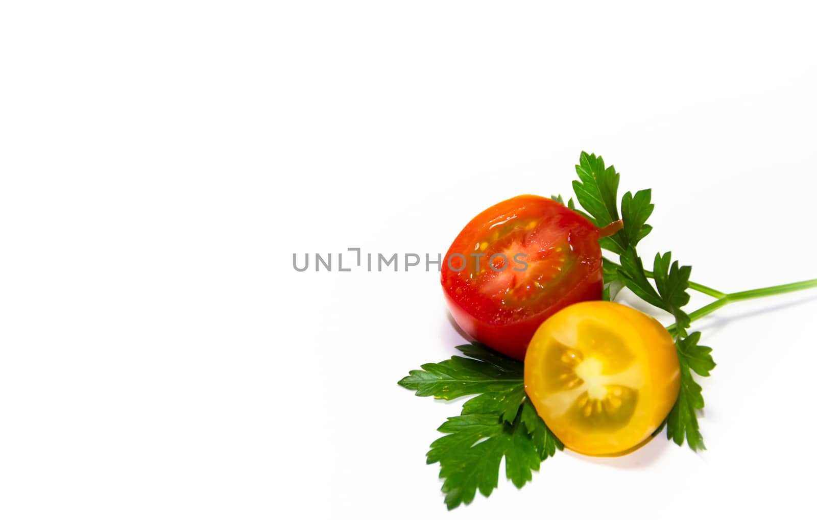 red and yellow cherry tomatoes on white background