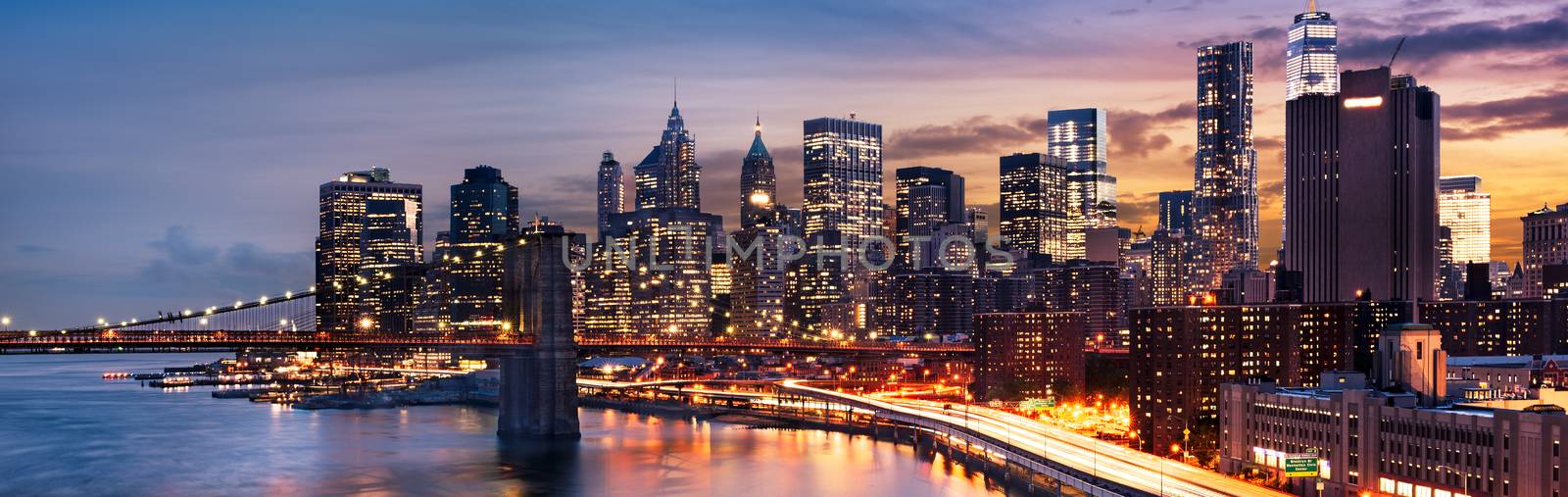 New York City - beautiful sunrise over manhattan with manhattan and brooklyn bridge USA