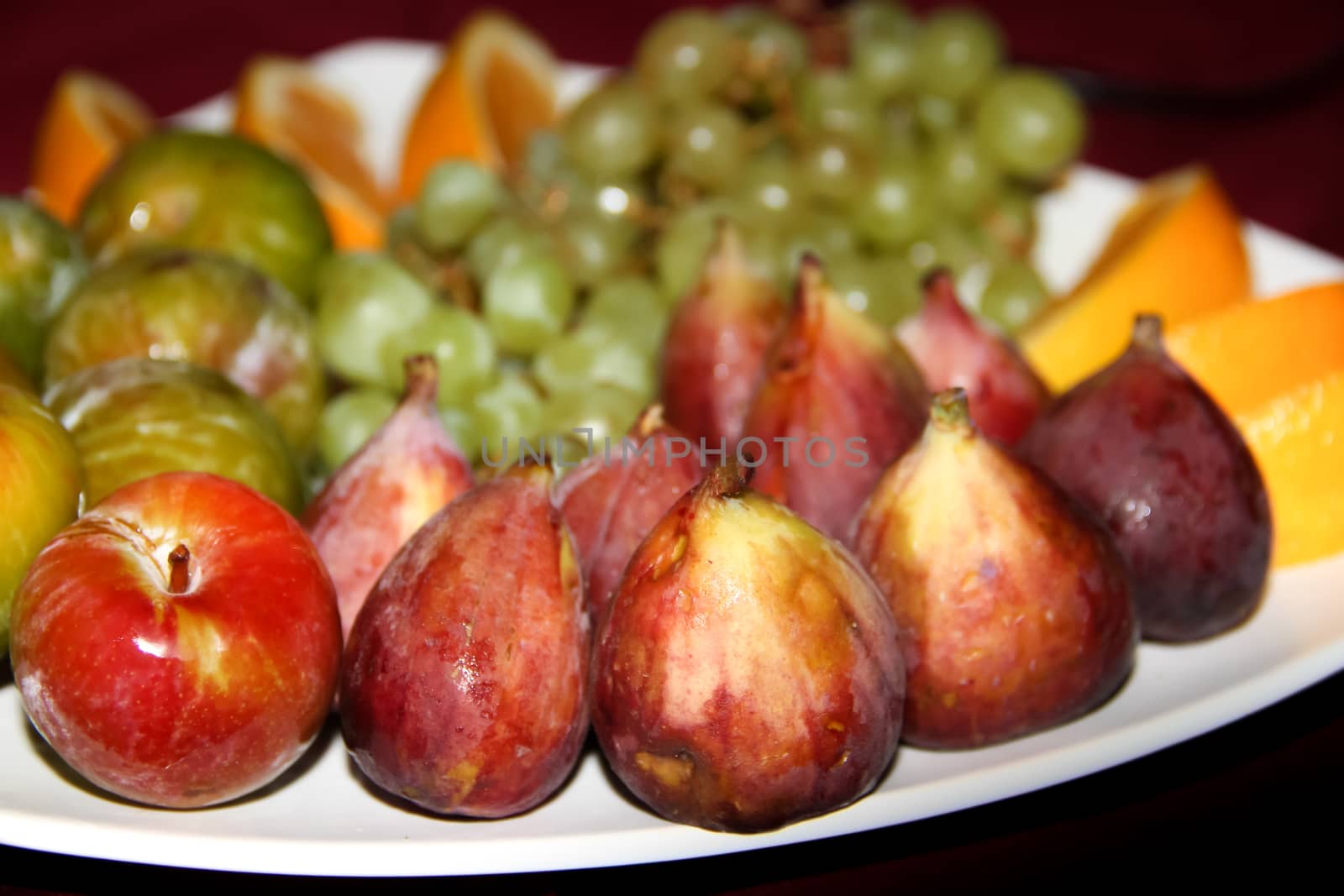 variety of fresh fruits served on a plate