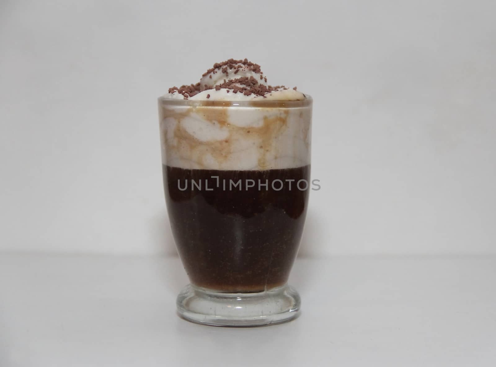 espresso irish coffee with cream and chocolate on white background
