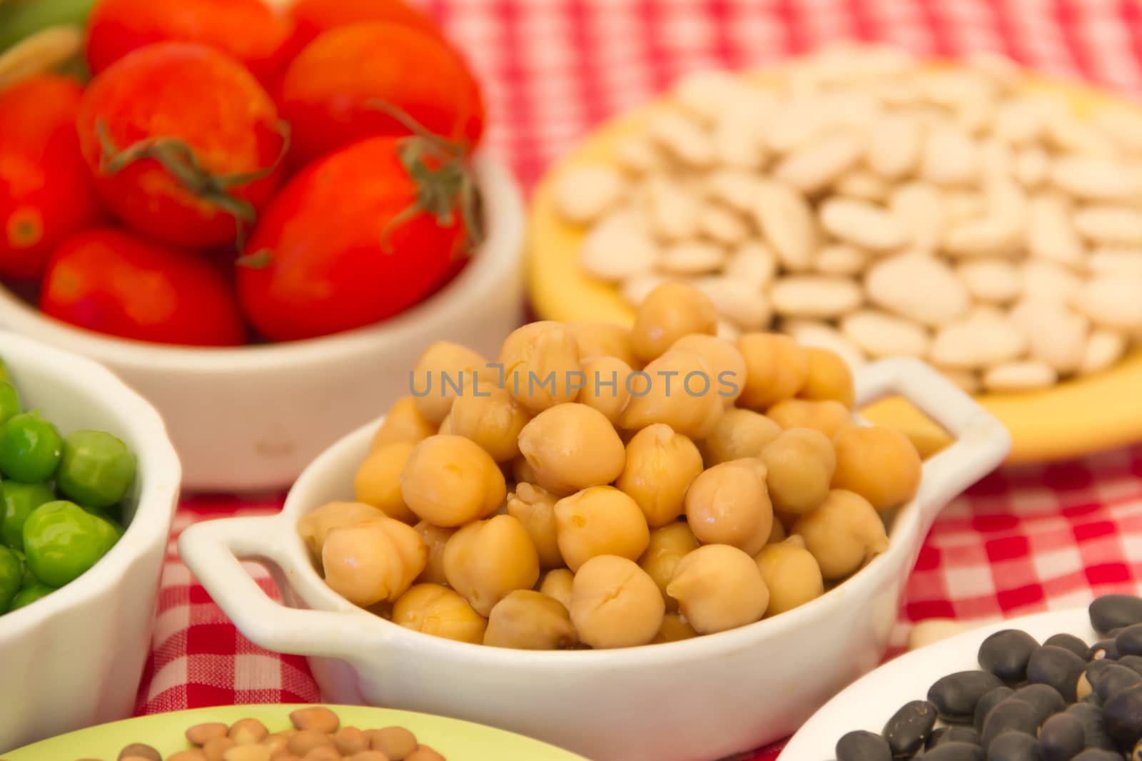 variety of kitchen ingredients with fresh and dried legumes