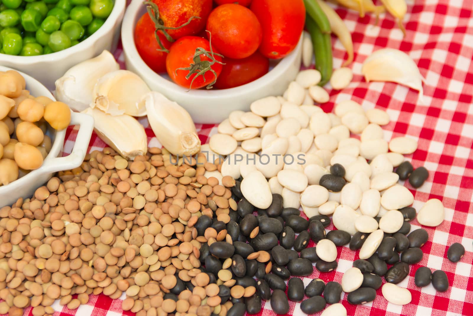 variety of kitchen ingredients with fresh and dried legumes
