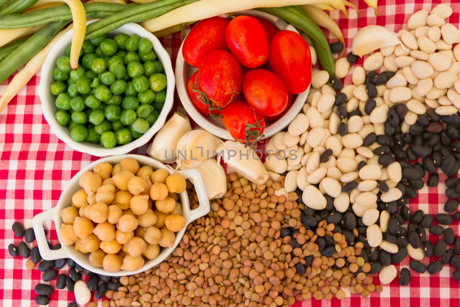 variety of kitchen ingredients with fresh and dried legumes