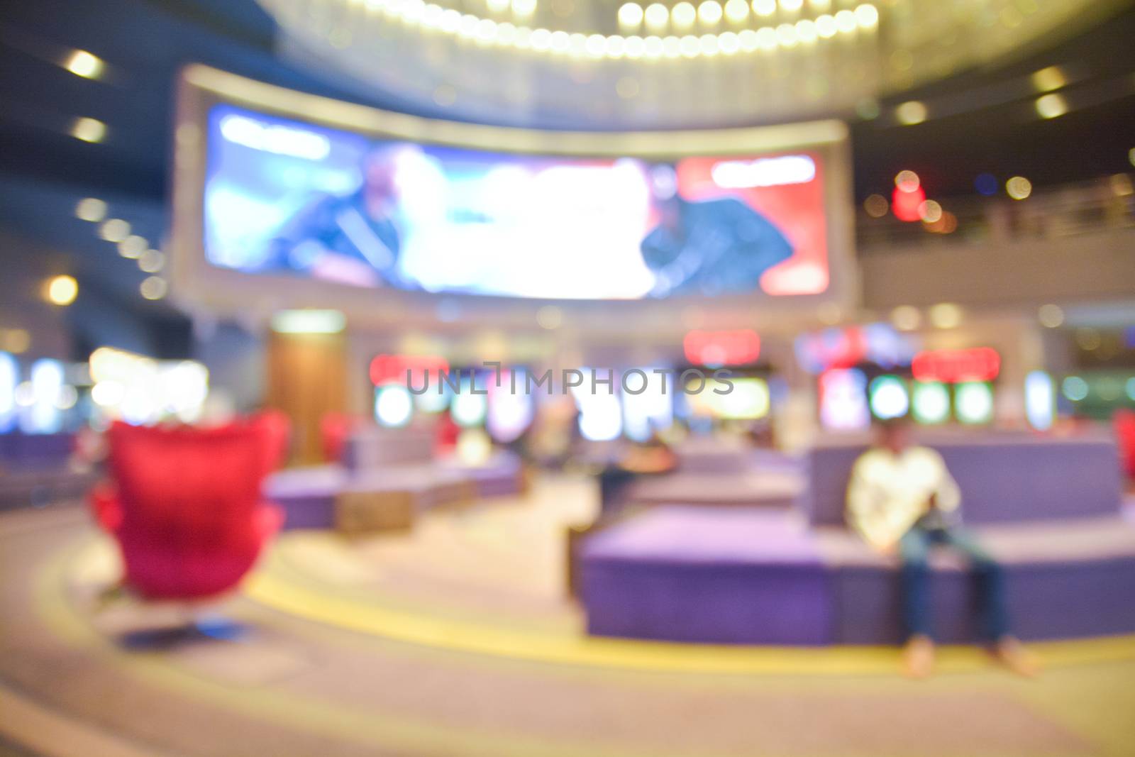 Blur of Defocus Background of People Waiting in Movie or Cinema Complex Lounge