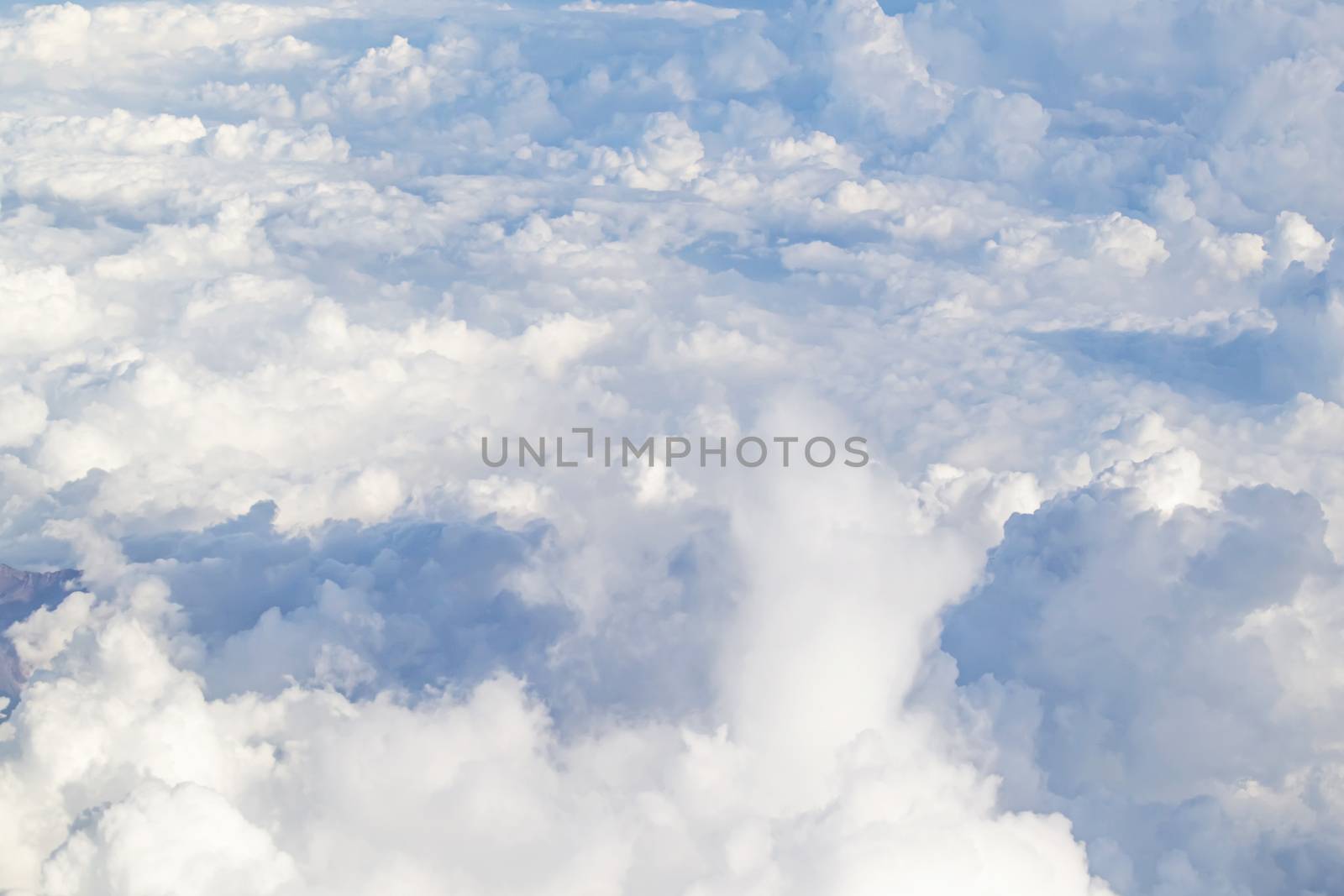 The Beautiful sky with white clouds taken picture on airplane