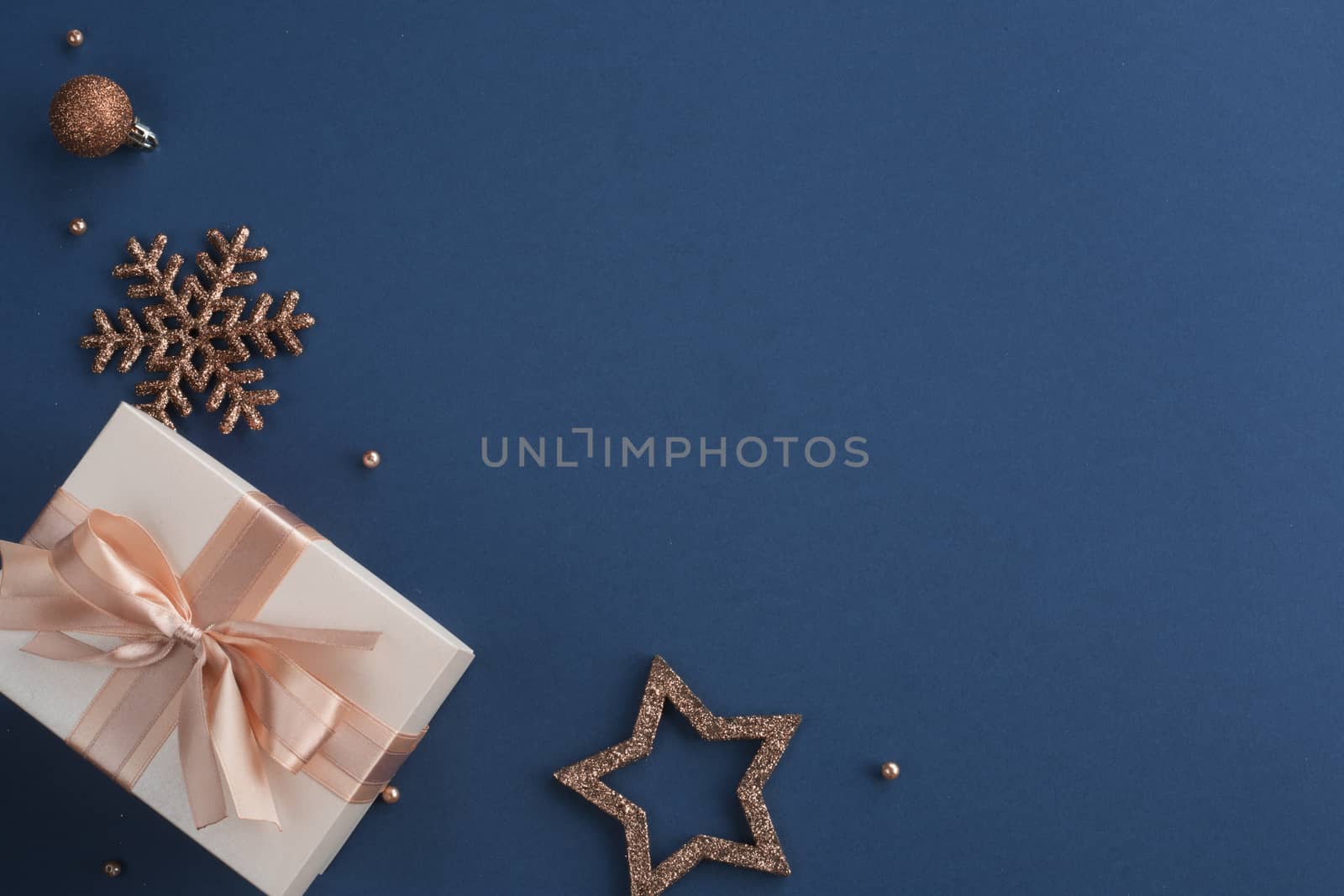 Christmas gift on blue background by destillat