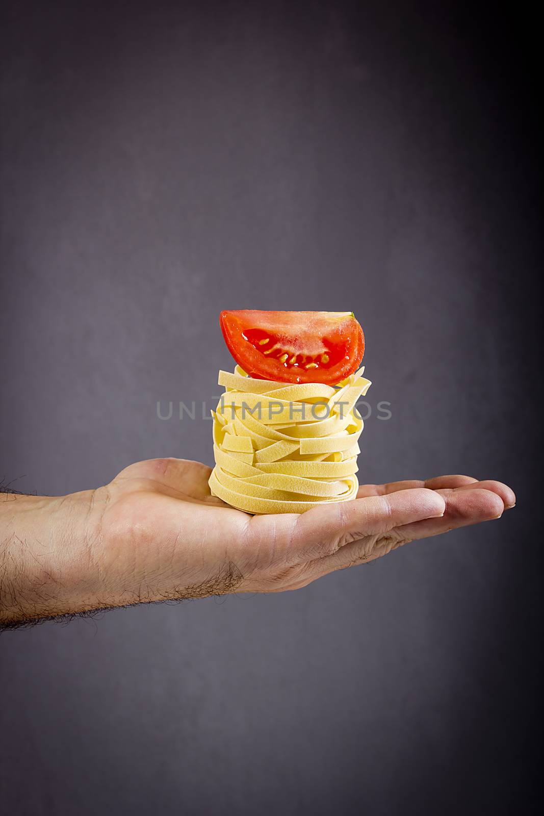 Pasta and tomato in hand by VIPDesignUSA