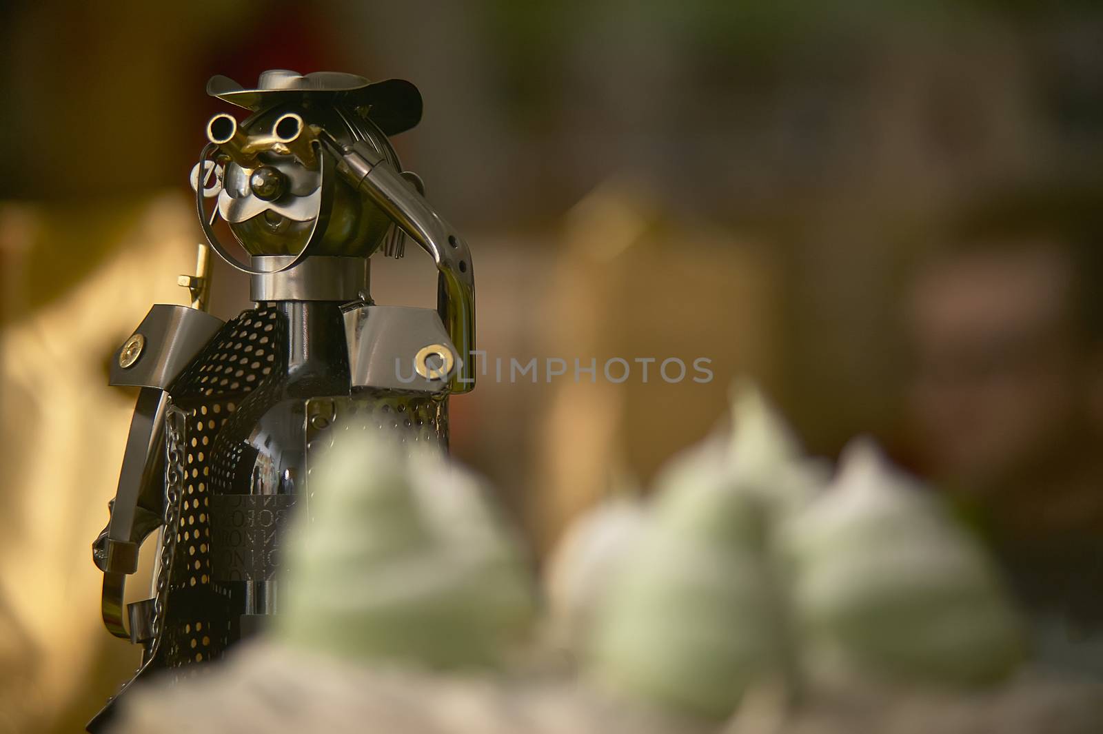 Tin toy soldier used as a decorative bottle holder in the table of a luxury dinner.