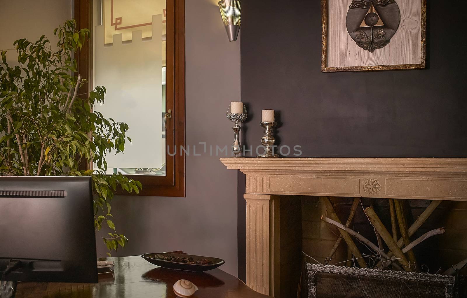 View of the interior of a luxury office with soft lighting and vintage furnishings.