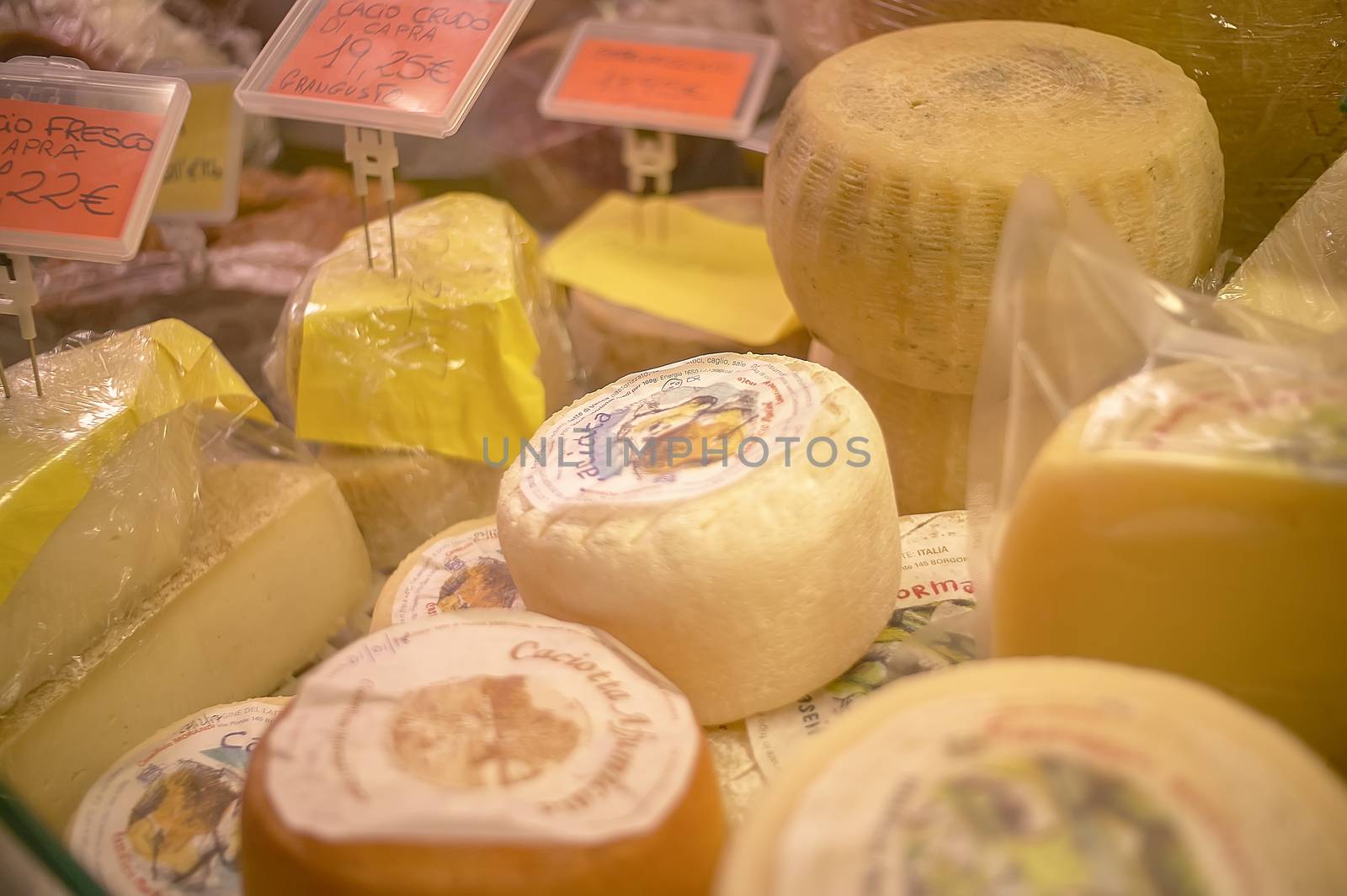 Many pieces of cheese ready to be sold at the supermarket