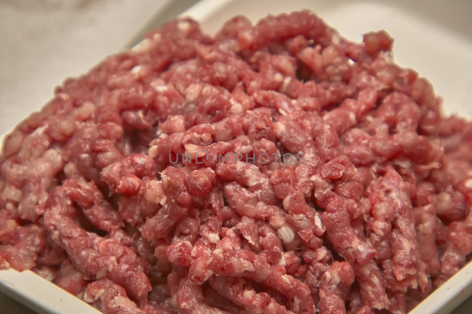 Bowl of minced beef in macro shot, ready to be used in the kitchen for some creative recipe.