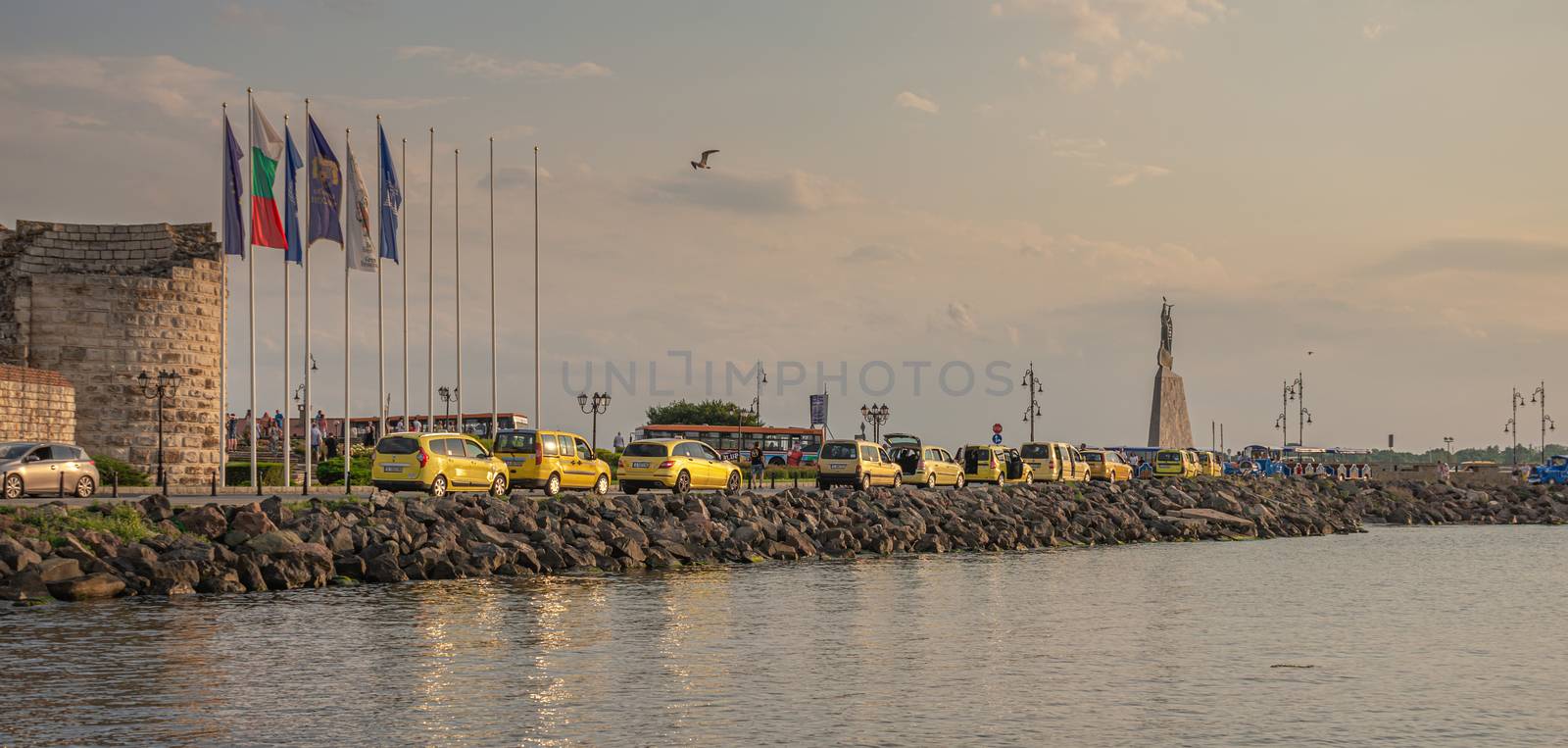 Nessebar, Bulgaria – 07.09.2019. Taxi parking near the main entrance to the city of Nessebar, Bulgaria, on a sunny summer evening