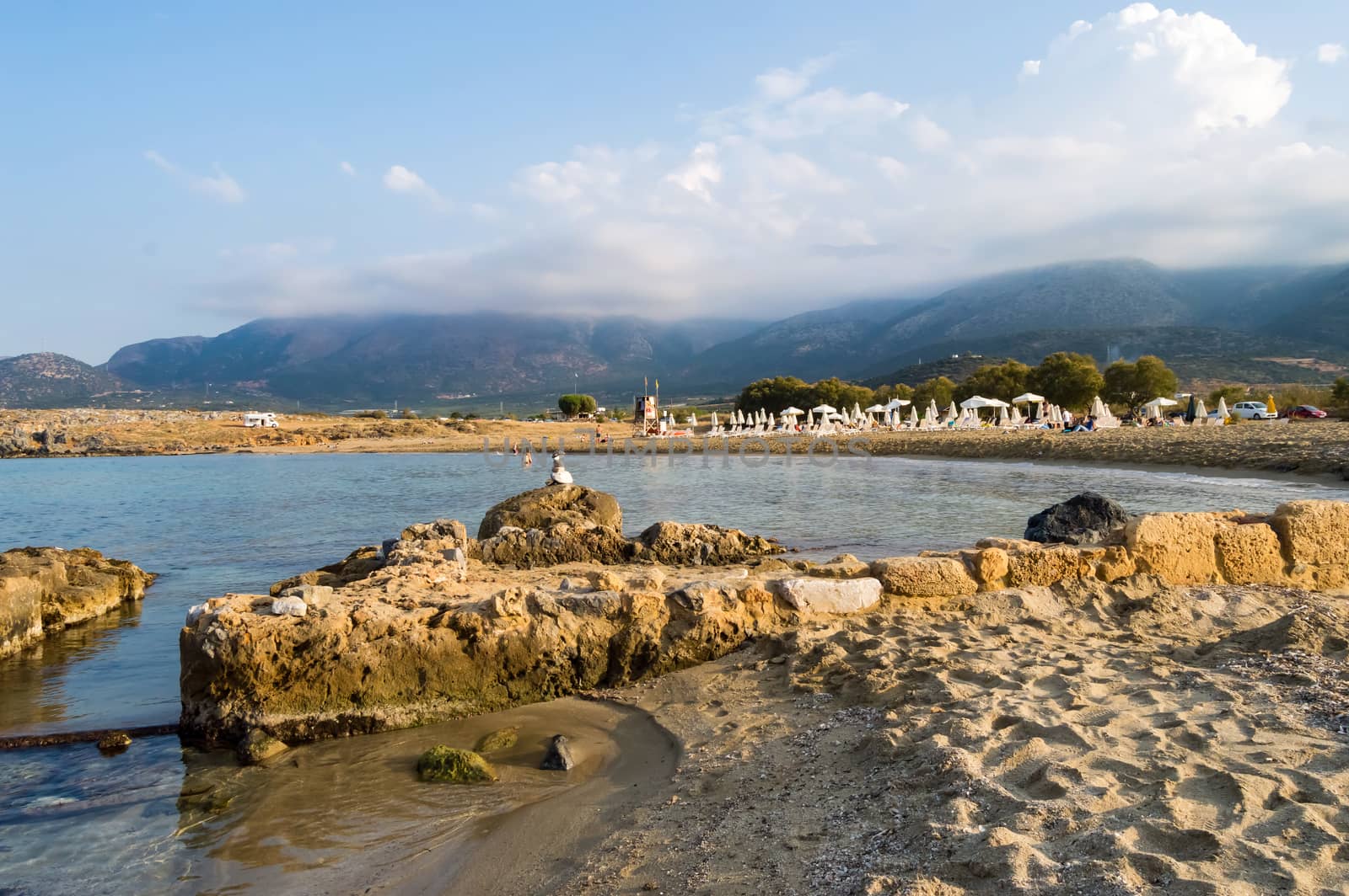 Beautiful wild beach with clear turquoise water and rocks.  by Philou1000