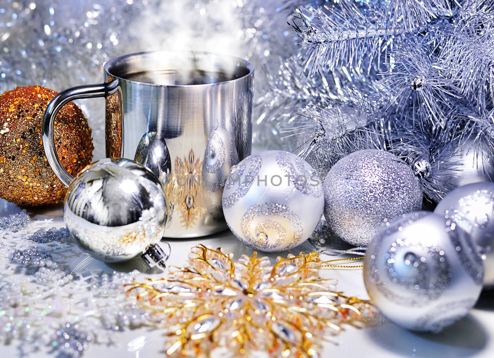 Christmas decoration with balls, tree and a cup of hot coffee
