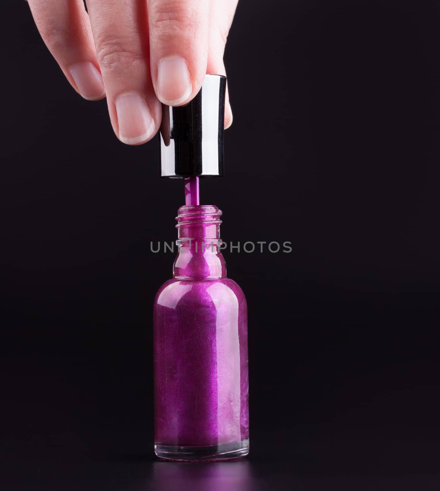 Bottle of purple nail polish by lanalanglois