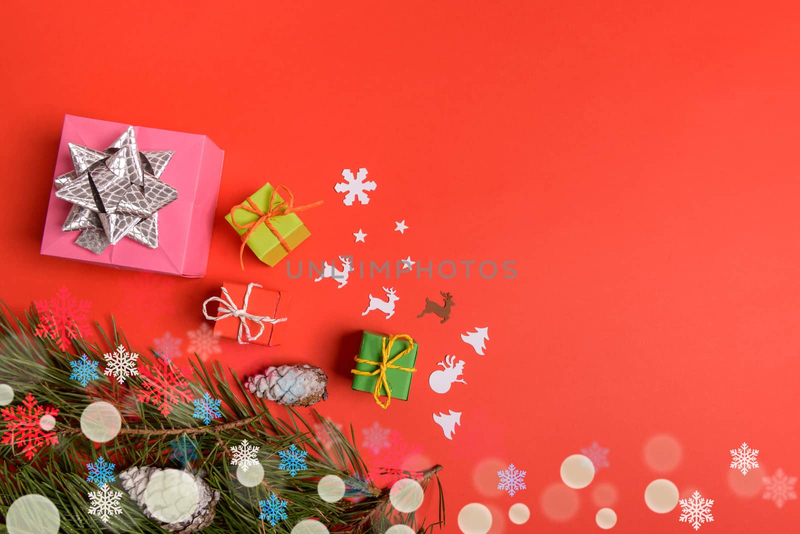Christmas or New Year background, plain composition made of Xmas decorations and fir branches, flat lay, blank space for a greeting text.
