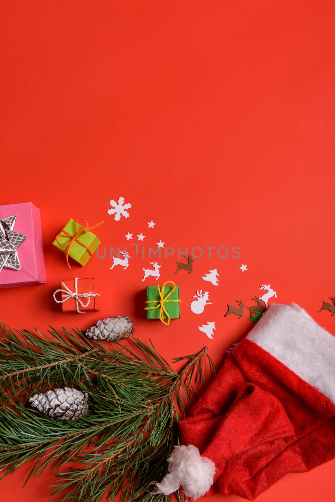 Christmas or New Year background, plain composition made of Xmas decorations and fir branches, flat lay, blank space for a greeting text.