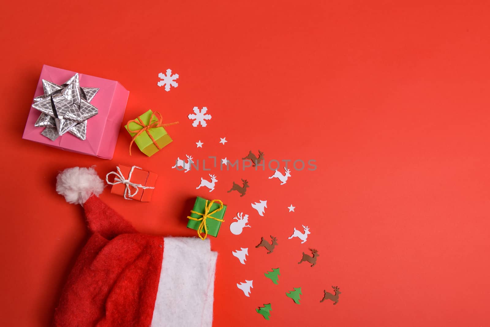 Christmas or New Year background, plain composition made of Xmas decorations and fir branches, flat lay, blank space for a greeting text.