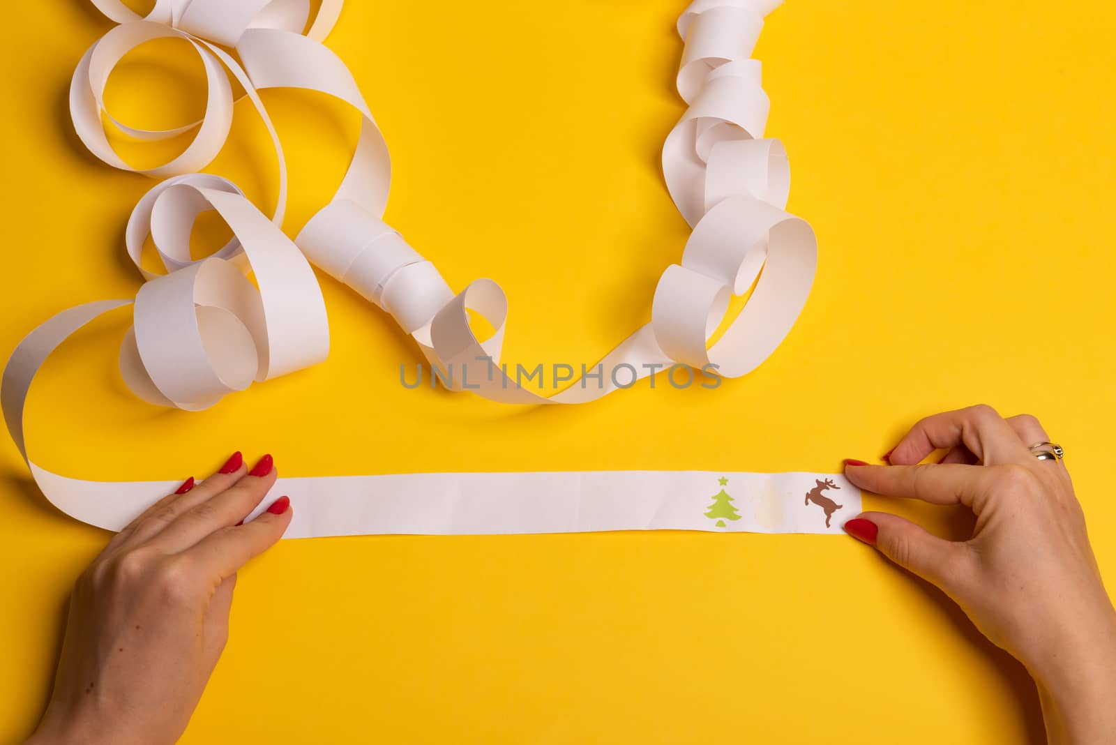 Long twisted expanded letter for Santa Claus. Copy space. yellow background