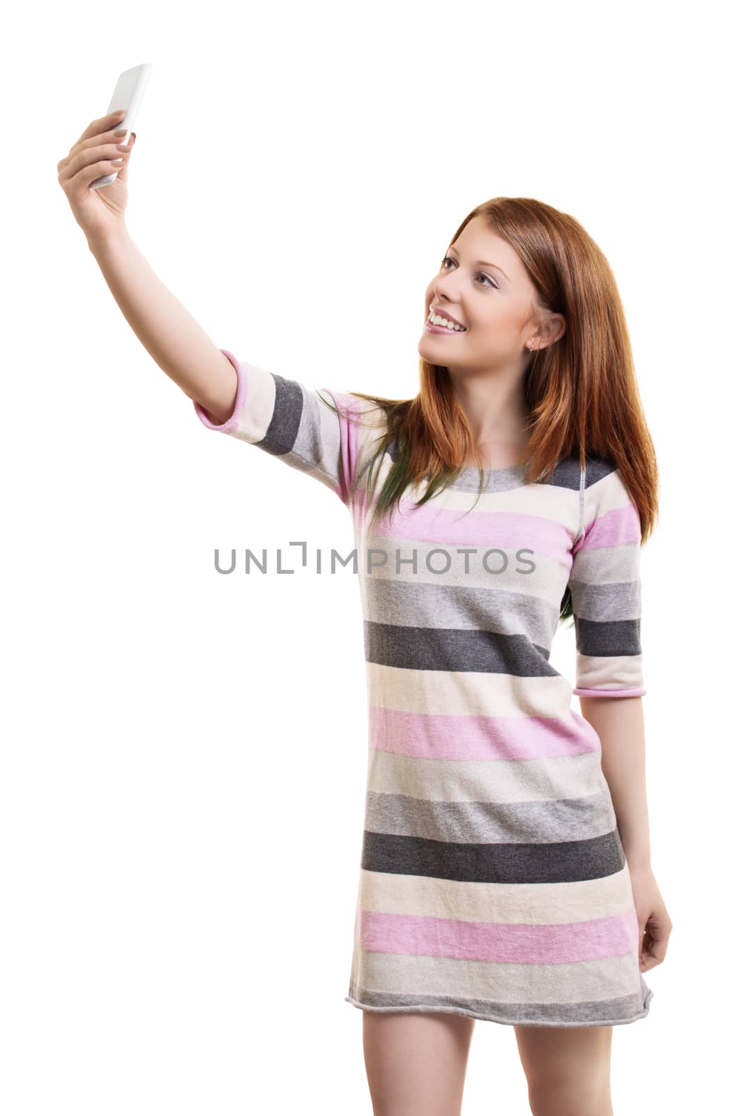 Young woman in a casual dress taking a selfie by Mendelex