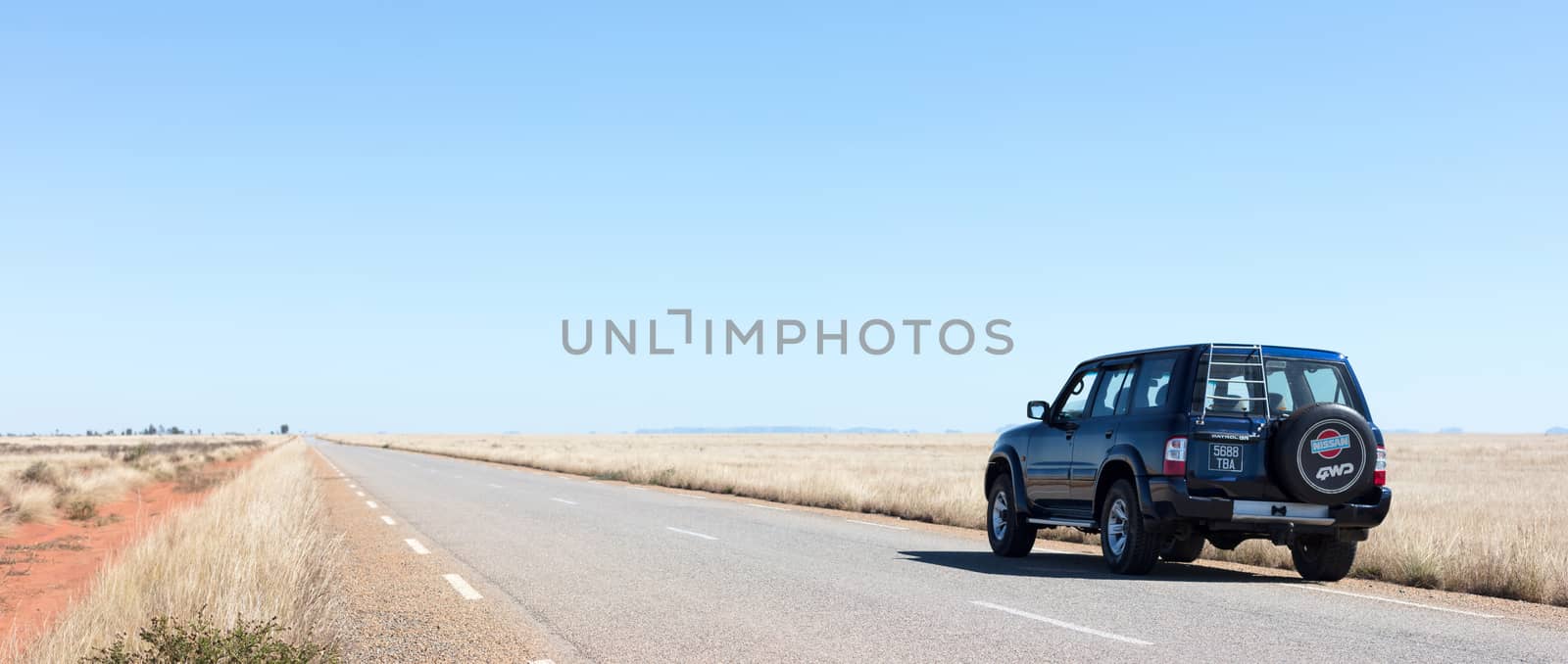 Madagascar on july 30, 2019 - A black car on a deserted road on Madagascar.