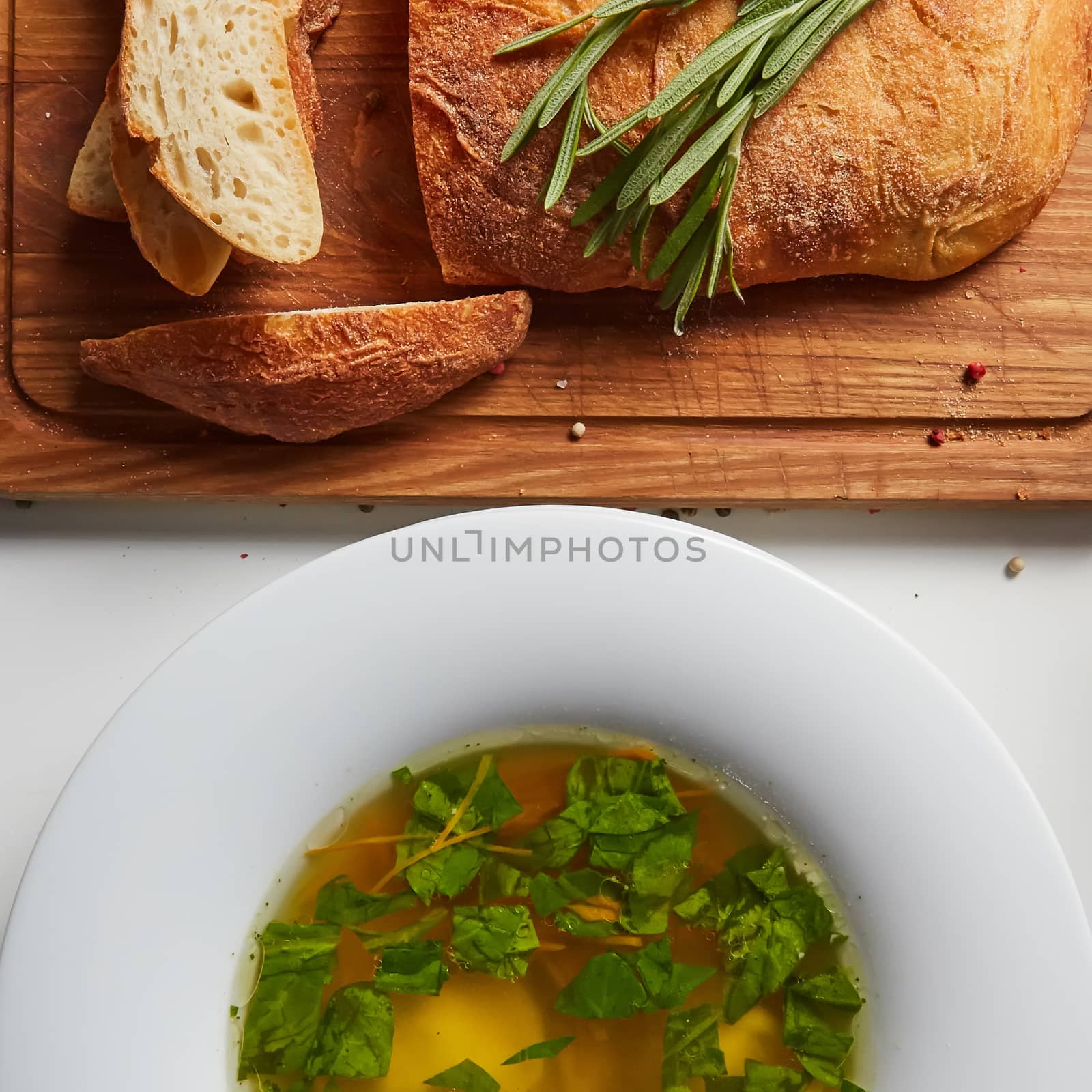 Hot broth with ravioli and green onions. Studio Photo. by sarymsakov