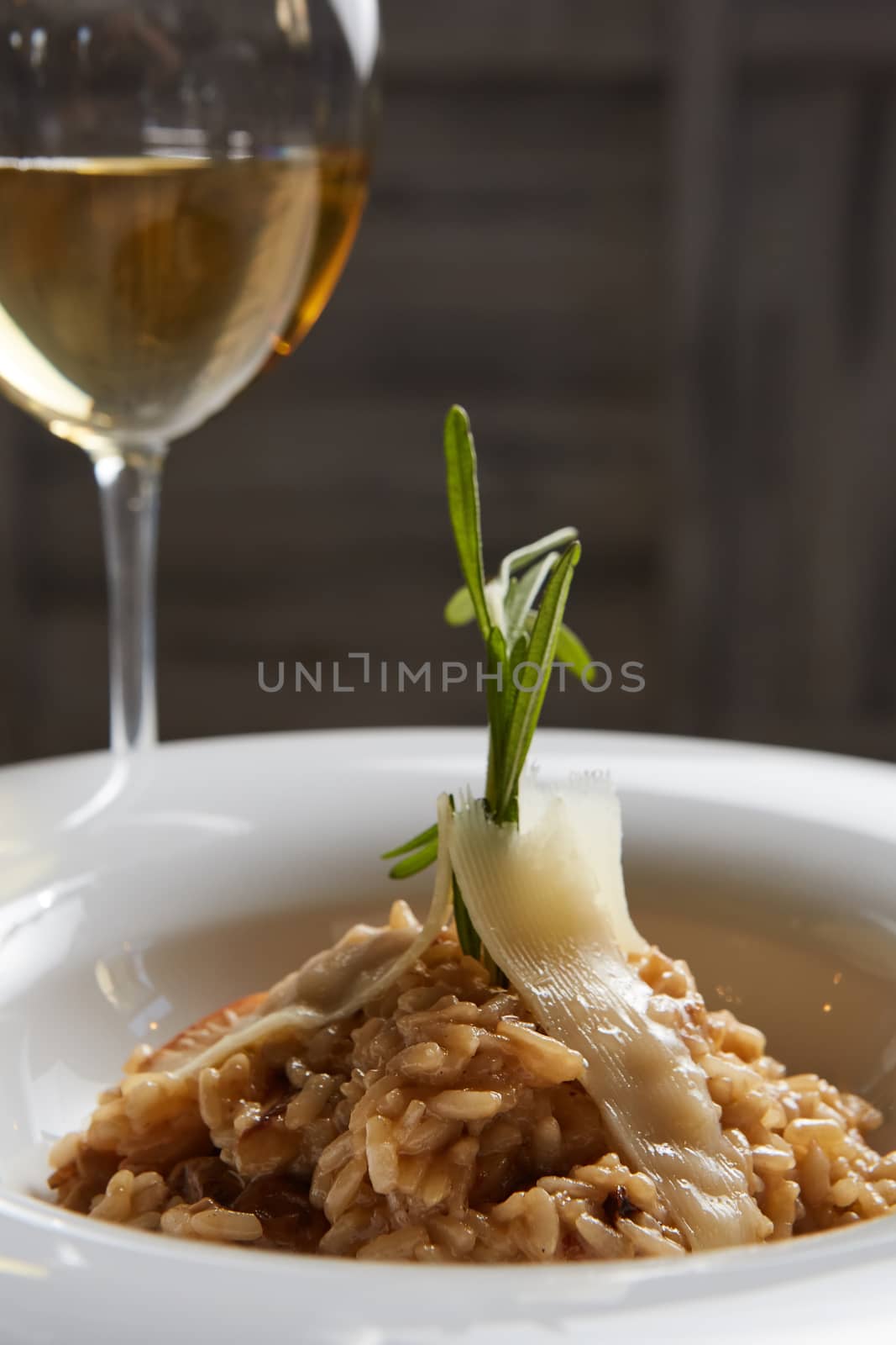 Italian dish risotto with wild white mushrooms and Parmesan chee by sarymsakov
