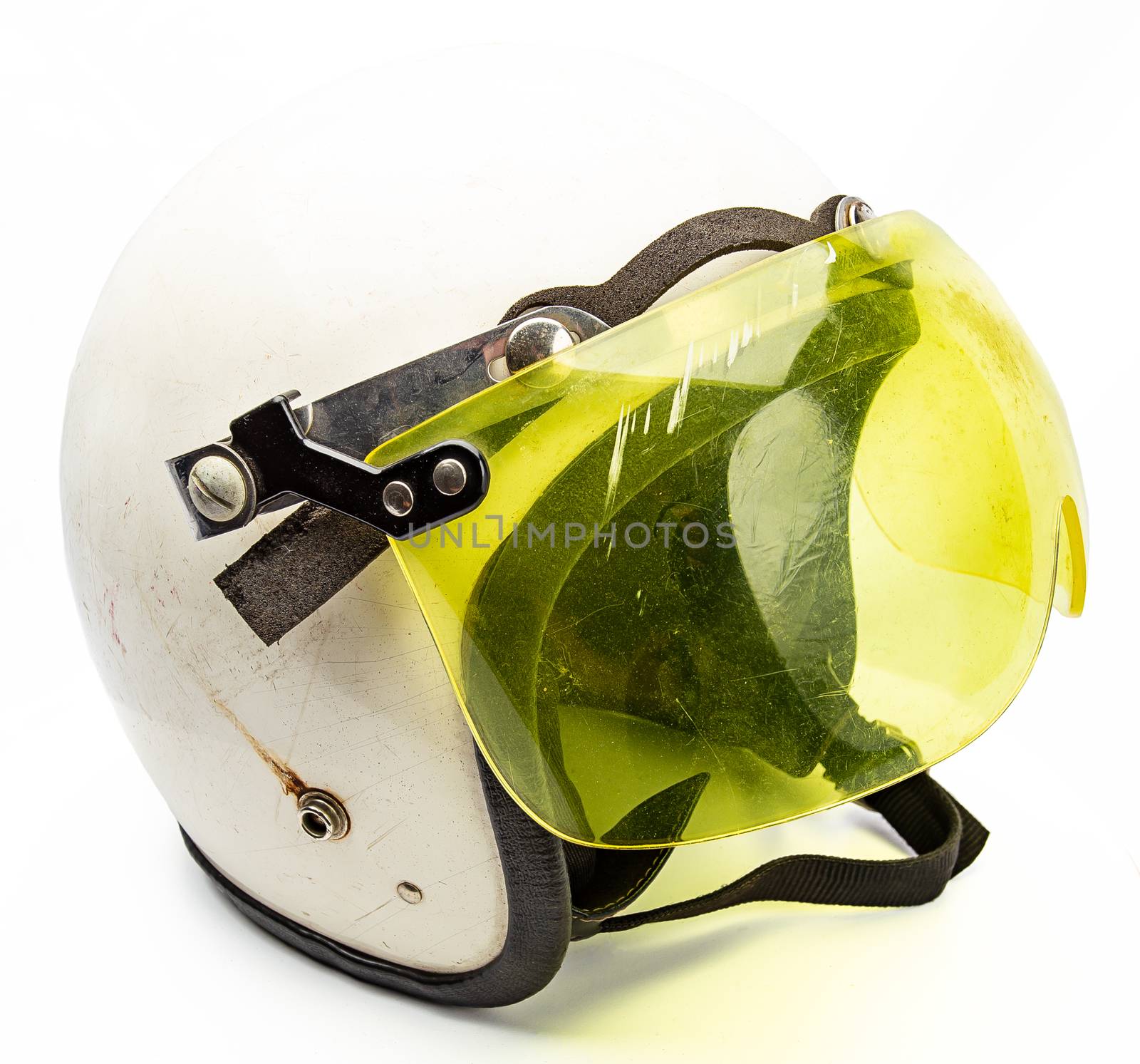 Old white snowmobile helmet with yellow visor
