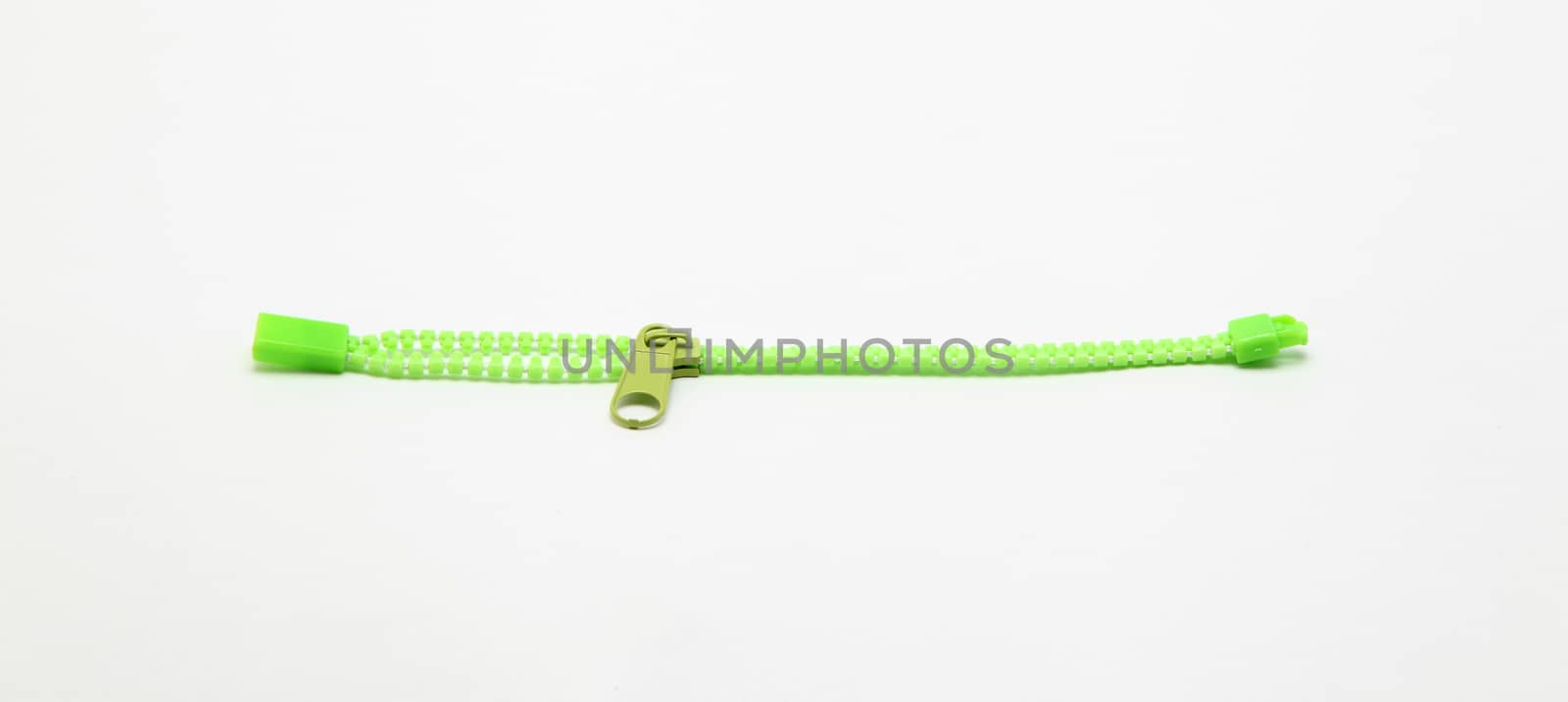 green zipper isolated on white
