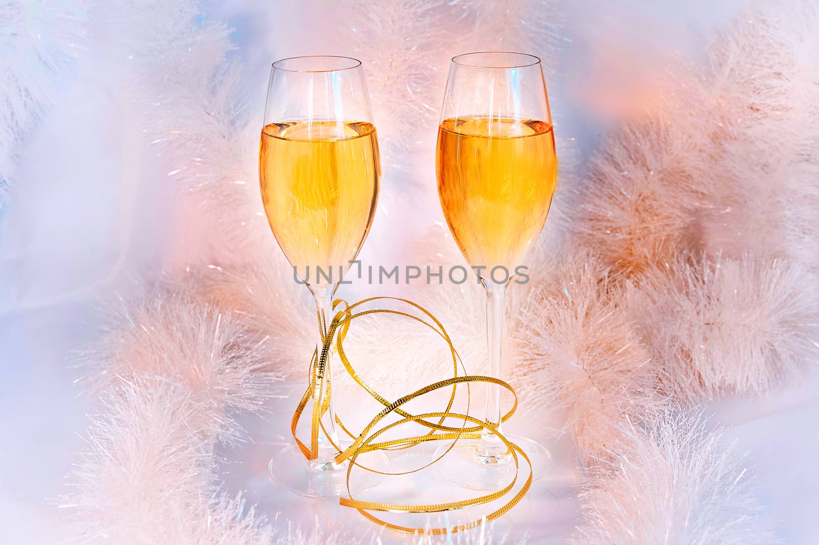 Two glasses of wine and tinsel. Holiday concept. by AlisLuch