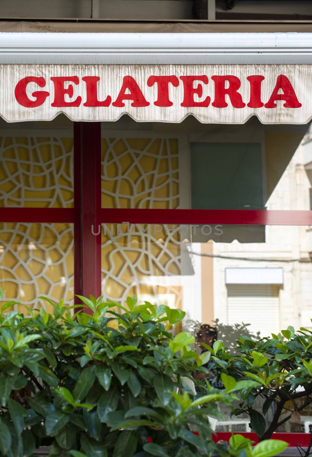 Text gelateria on sunblind. Italian ice cream. Facade on ice cre by deyan_georgiev