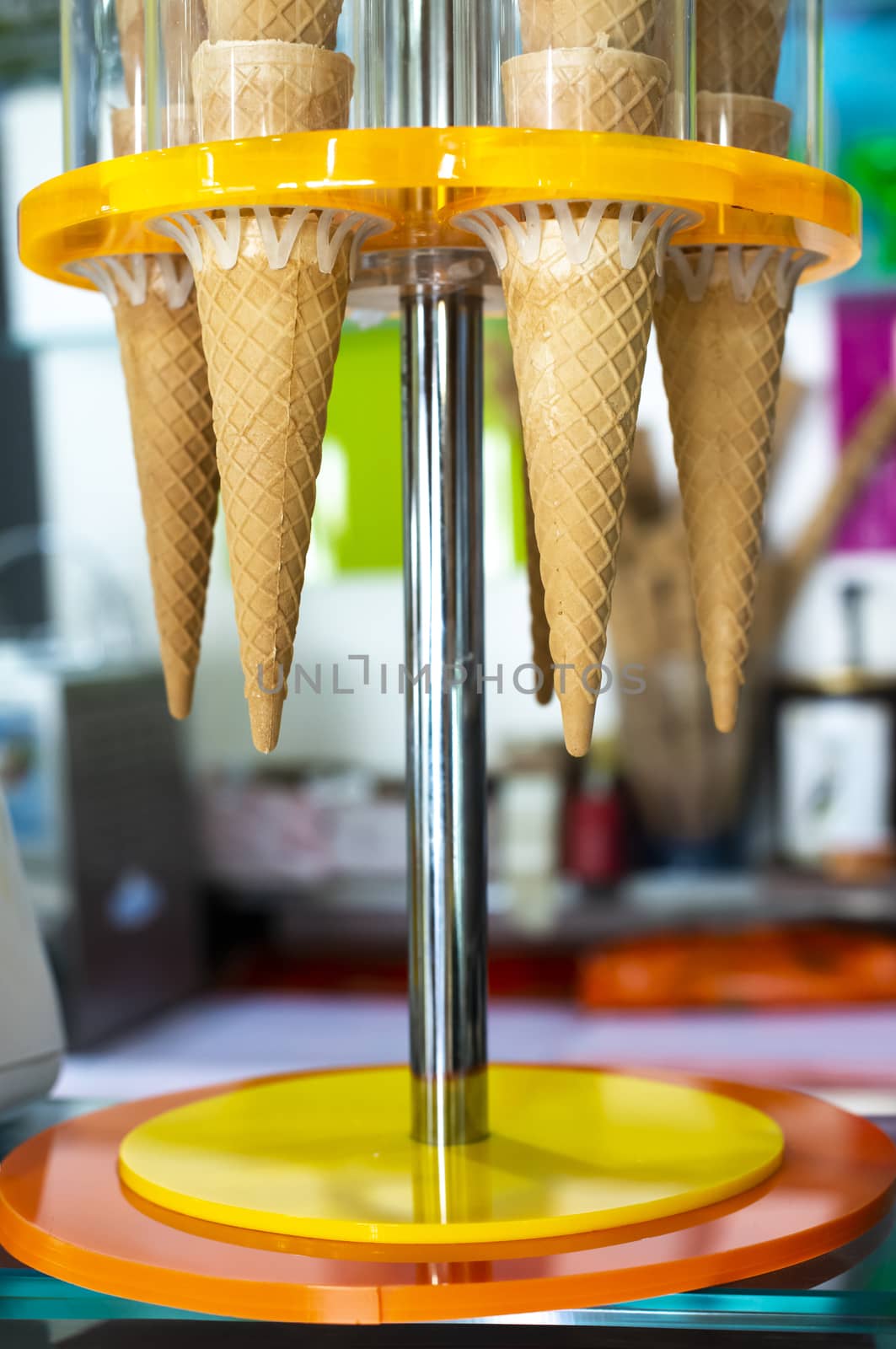 Waffle cones for ice cream put on stand. Ice cream shop.  by deyan_georgiev