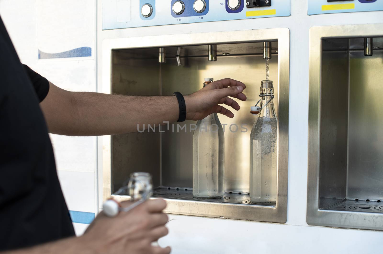 Mineral Water machine on the street. Pay and load drinking water by deyan_georgiev