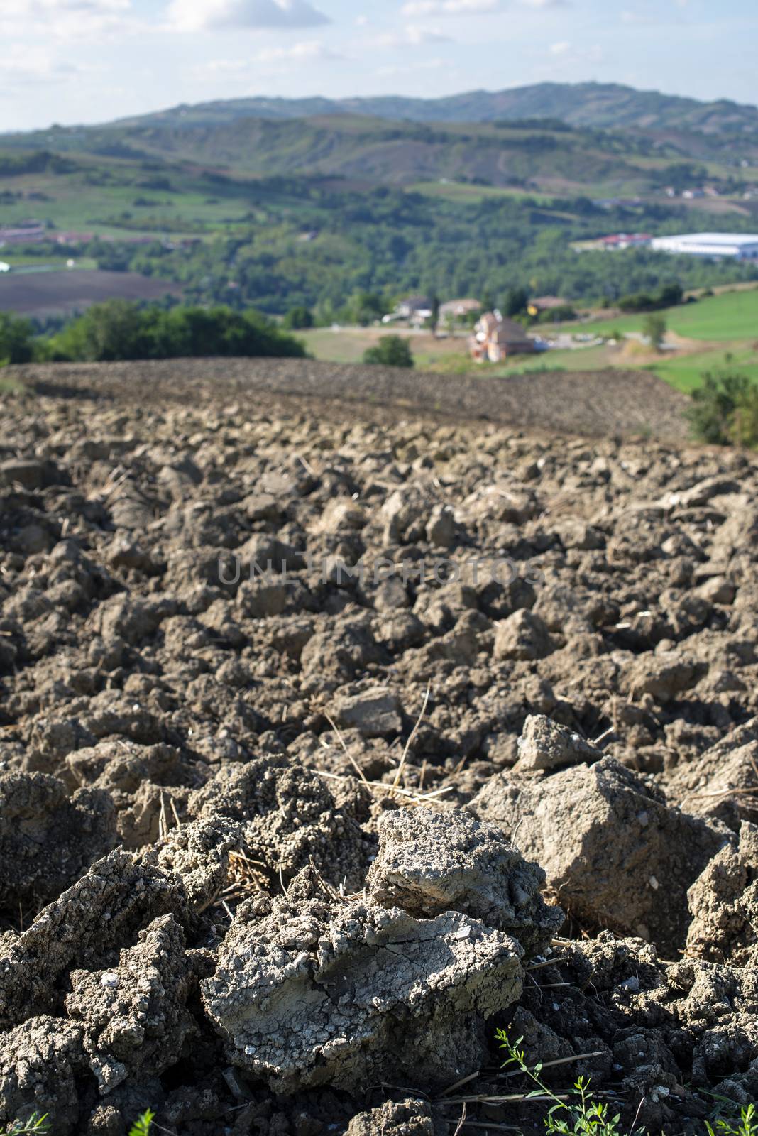 Ploughed soil close up. Sunny day. Agriculture farming concept.