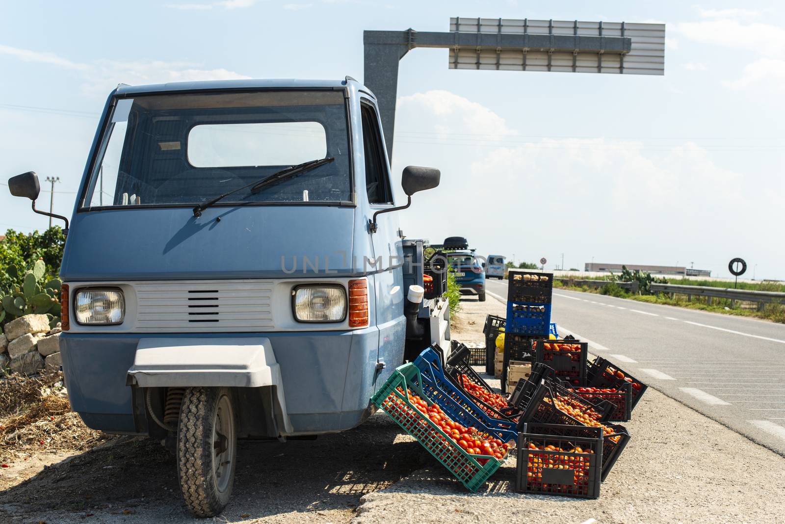 Small italian apo truck with tomatoes. Farmer sale tomatoes on t by deyan_georgiev