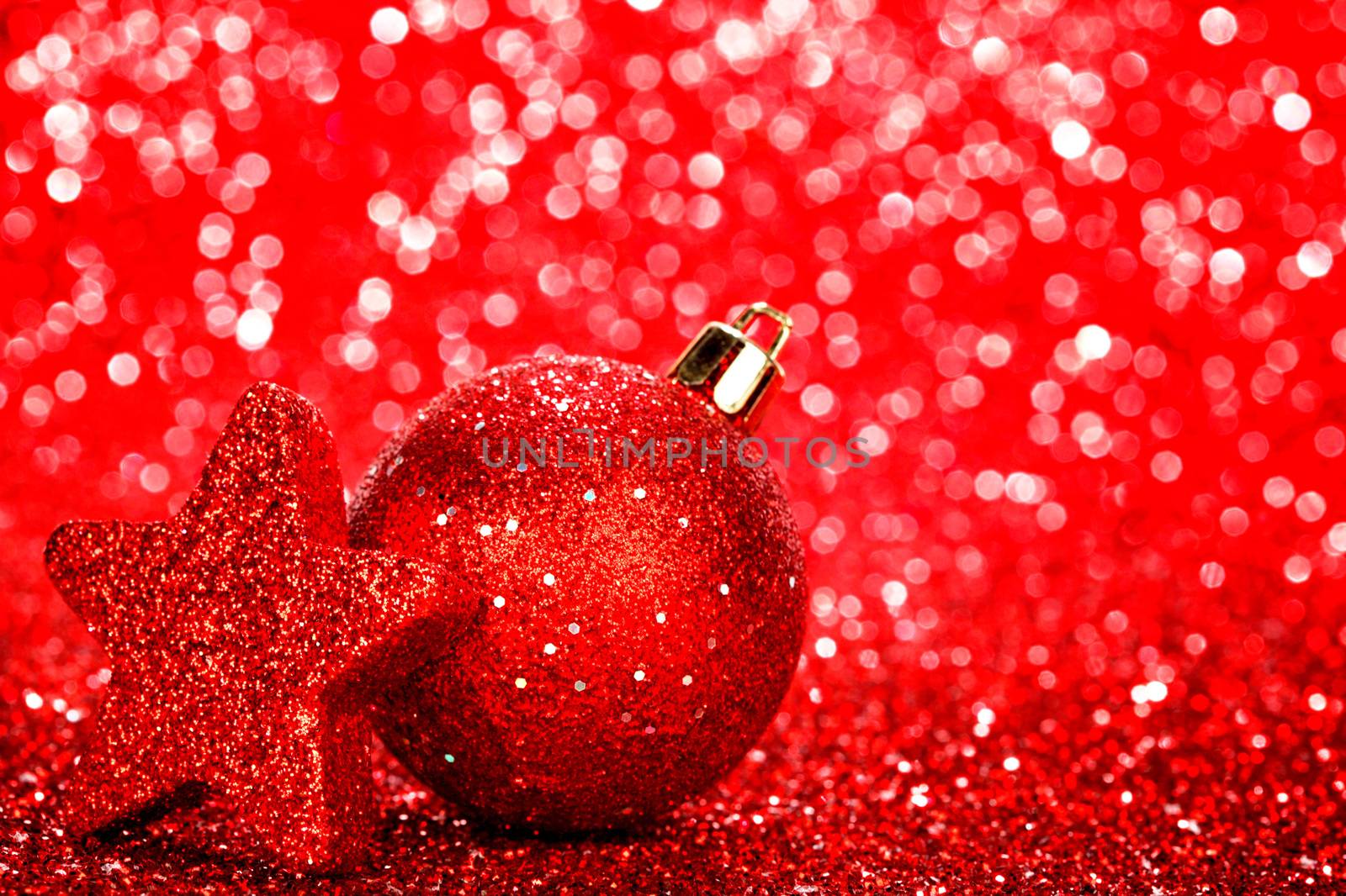 Beautiful red christmas balls on abstract glitter background close-up