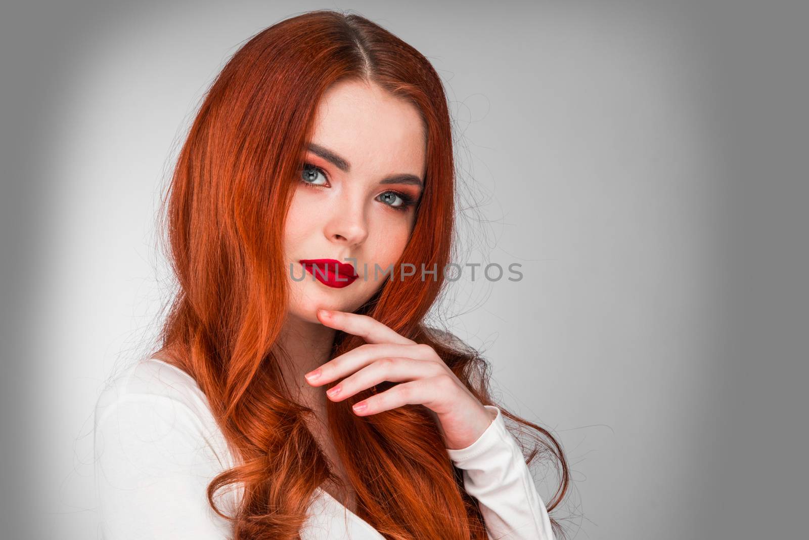 Photoshot of gorgeous redhead girl with bright makeup