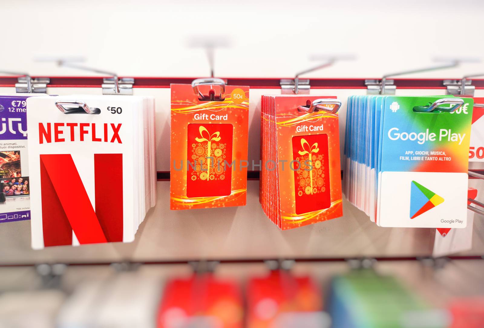 Gift cards for subscriptions services like Netflix, Google Play and others on the shelves of a super store shop in Bologna, Italy, 9 Nov 2019