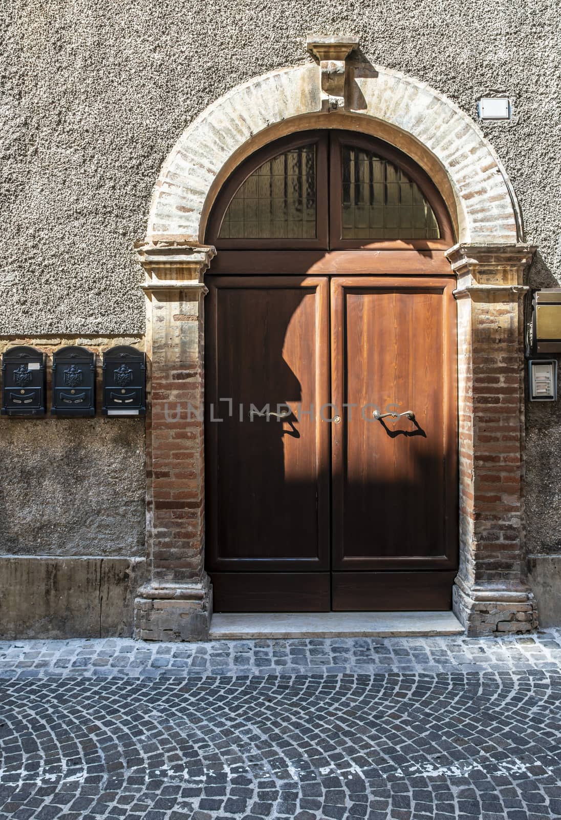 Typical italian facade with door.  Italian house.  by deyan_georgiev