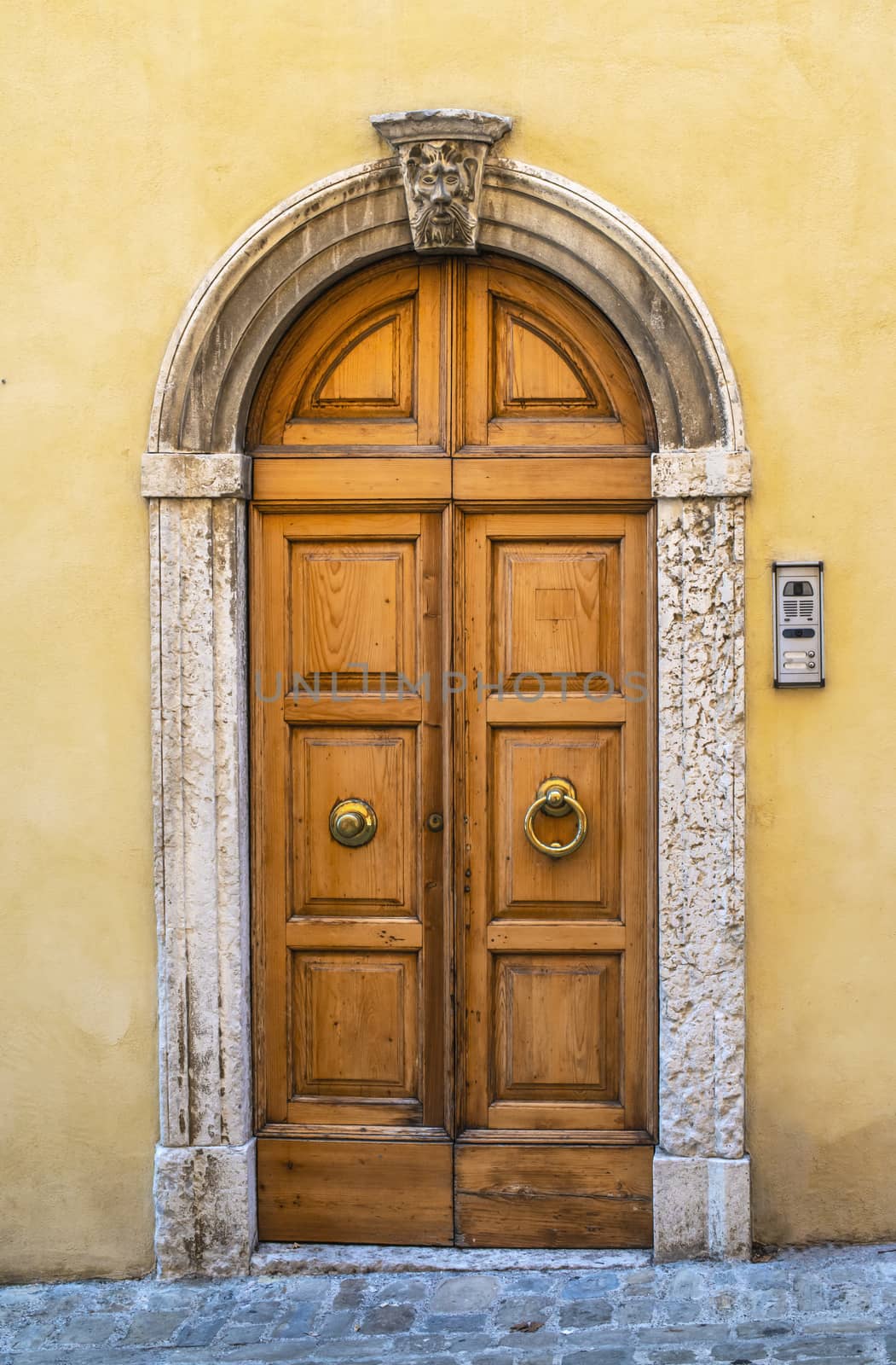 Typical italian facade with door.  Italian house. Traditional style and ornaments. 