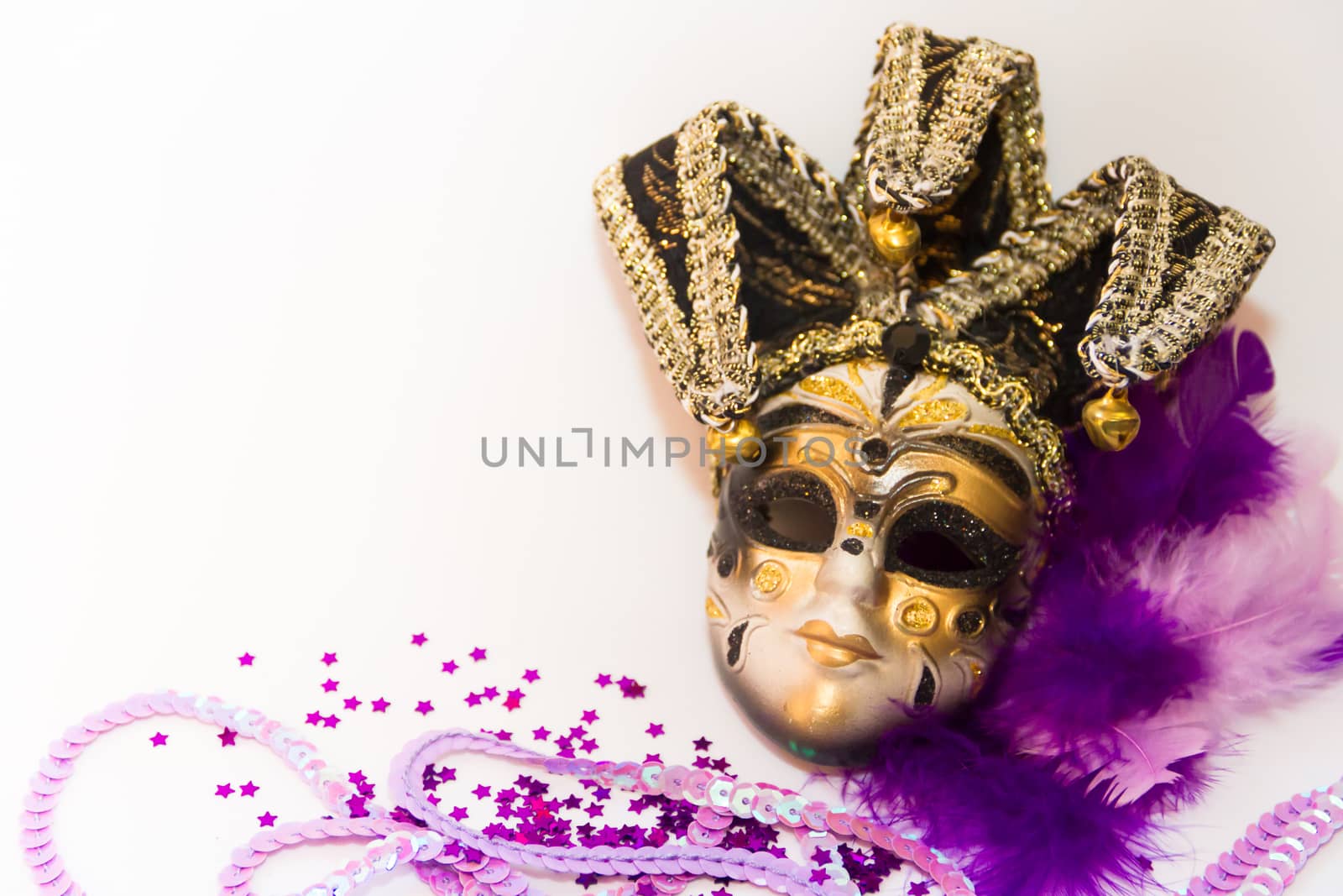 masks and feathers of venice carnival on white background