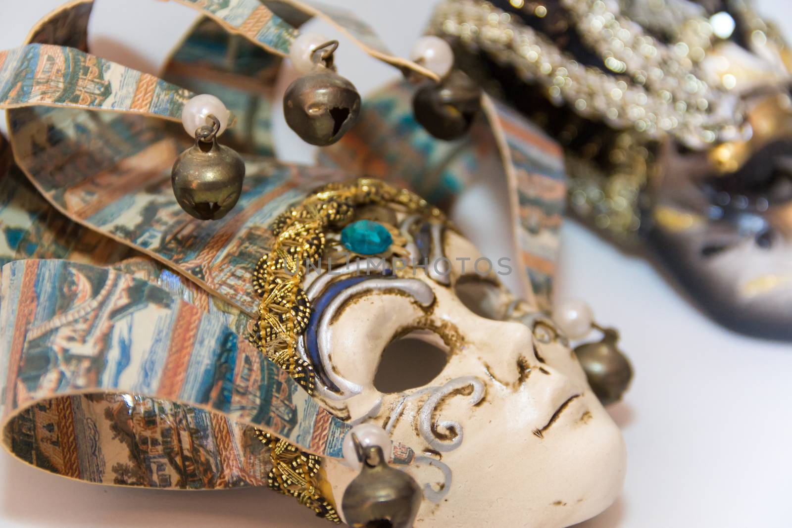 masks and feathers of venice carnival on white background