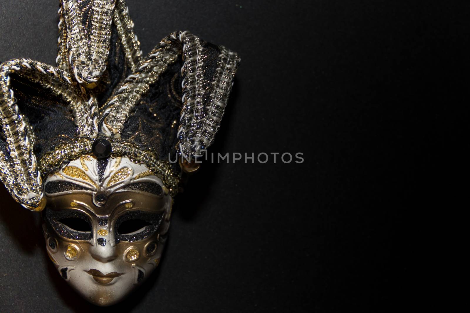masks and feathers of venice carnival on black background by GabrielaBertolini