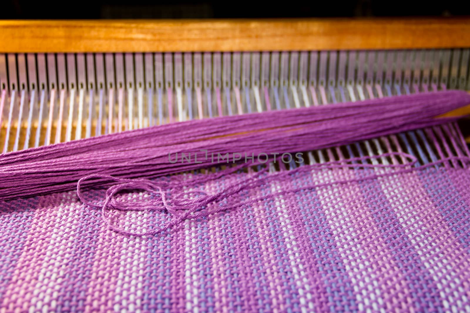 detail of fabric in comb loom with ultraviolet and lilac colors by GabrielaBertolini