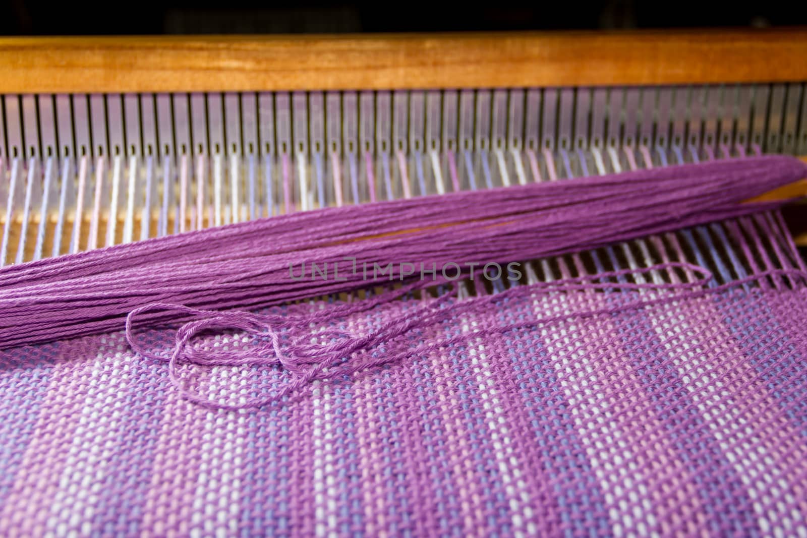 detail of fabric in comb loom with ultraviolet and lilac colors by GabrielaBertolini