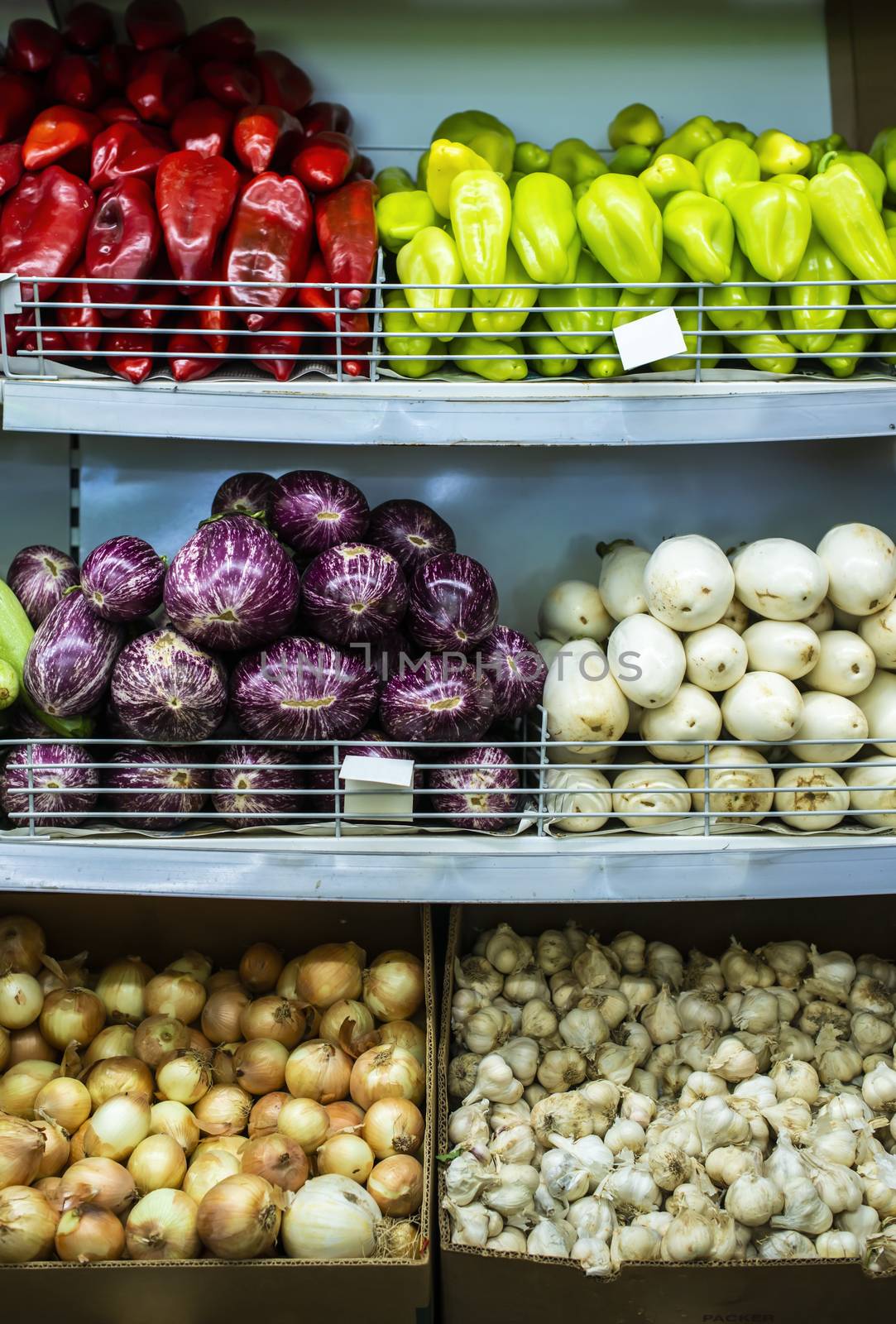 Vegetable on shelf in the market. by deyan_georgiev