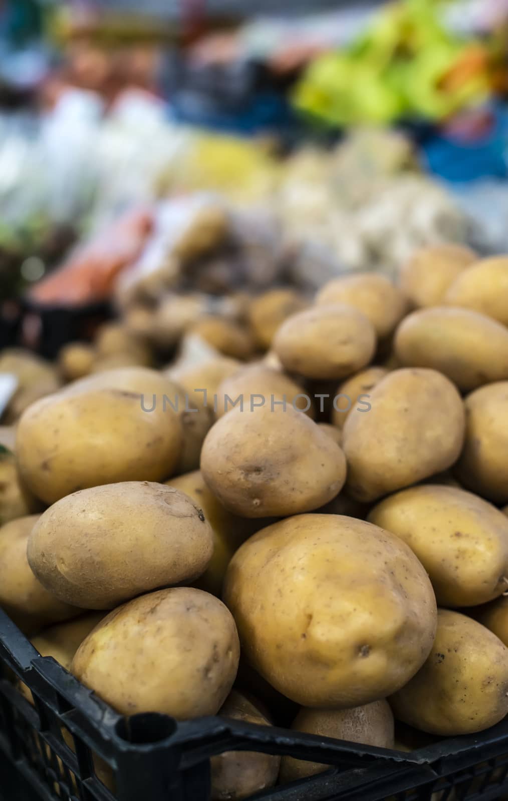 Potatoes in cate on the market.  by deyan_georgiev
