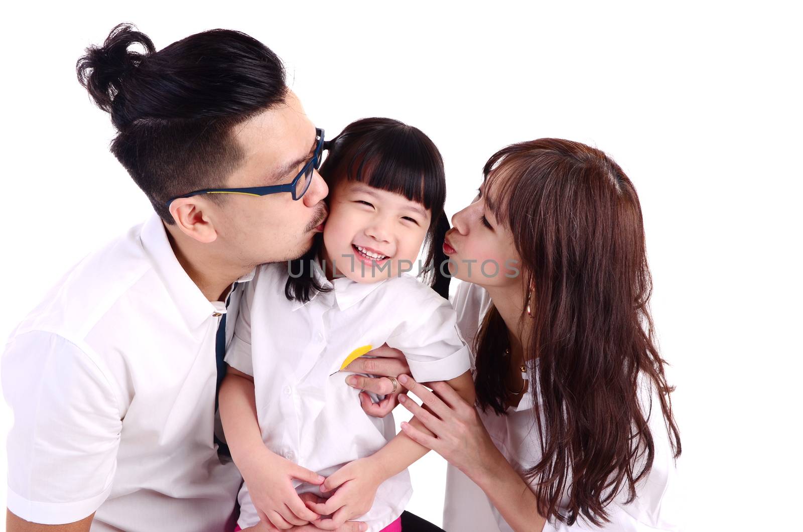 asian parent kissing their cute little girl